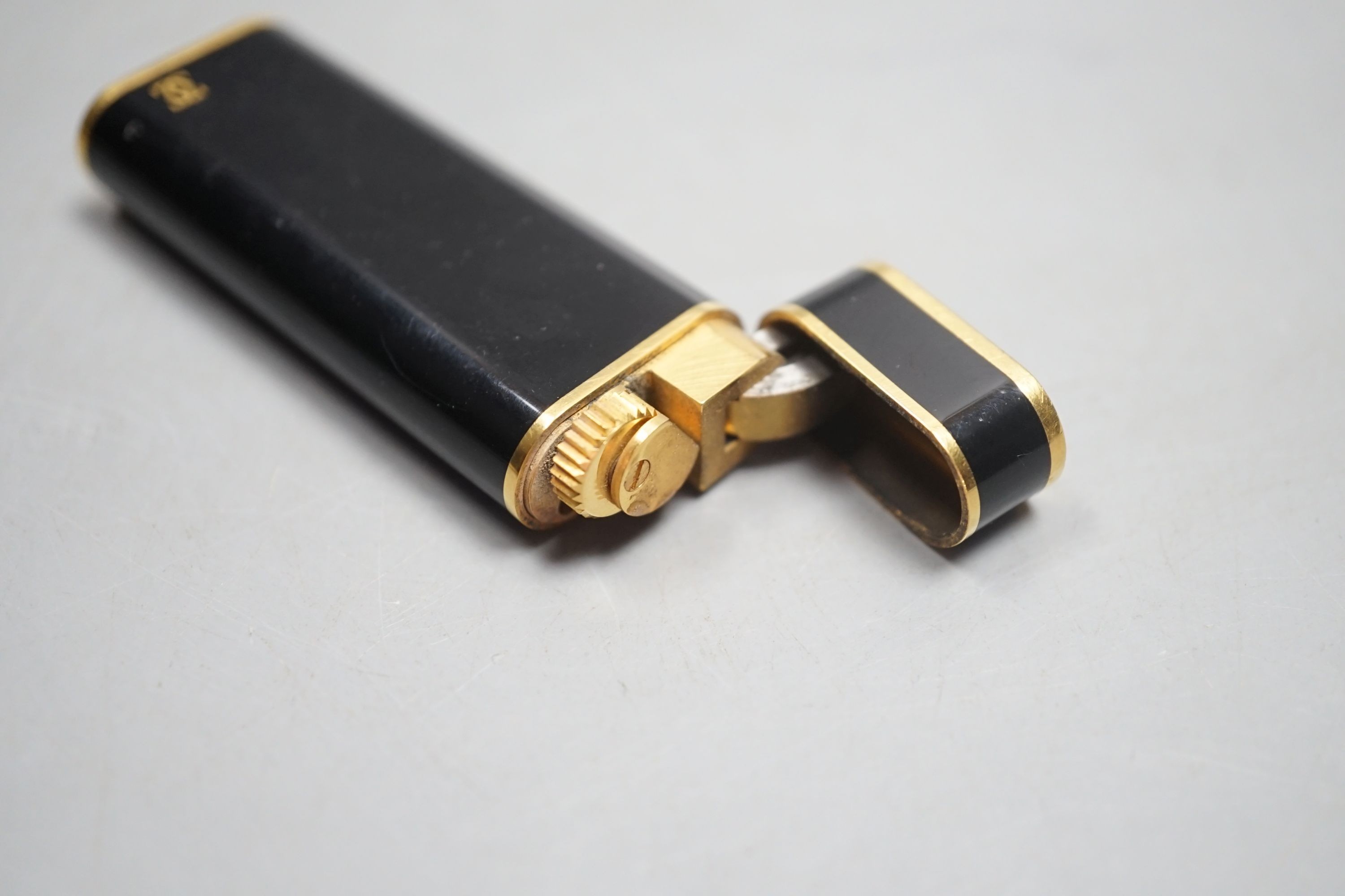 Cartier, black enamel and gold plated lighter